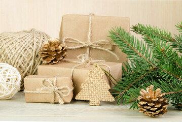 Gifts wrapped in kraft paper, tied with twine