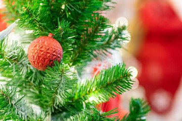 Fototapeta na wymiar Red christmas ball and gift decoration on christmas tree night scene
