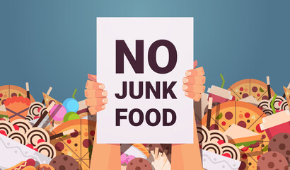 human hands holding no junk food placard unhealthy nutrition junkfood addiction stop fast food concept