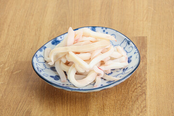 Marinated squid strips in the bowl