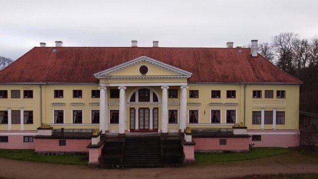 Fly over from the backside of the Durbe manor castle, areal outumn view, Tukums, Latvia