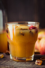 Traditional hot apple cider. Christmas drink with apples cinnamon, cranberry and anise. Homemade apple cider. Selective focus. Shallow depth of field.