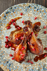Chicken in teriyaki sauce with pomegranate and honey concentrate. French gourmet cuisine