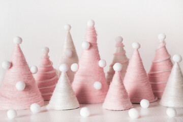 Diy Christmas trees is made of pink yarn. Eco-friendly fluffy Christmas decor