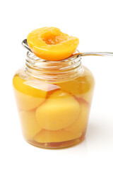 peaches in syrup on a white background 