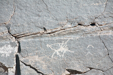 Detail of prehistoric rock painting petroglyphs depicting camel, Wadi Rum desert, Jordan