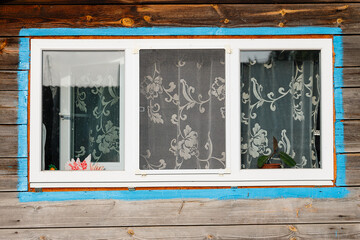 The window of a wooden farmhouse