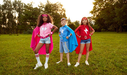 Company of diverse kids in superhero costumes © kegfire
