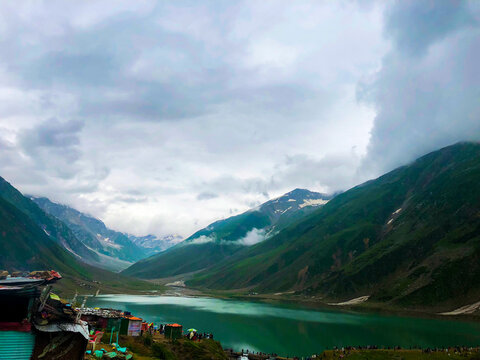 Beautiful View Of Lake Saif Al Maluk with people standing near lake in Naran Valley, Pakistan