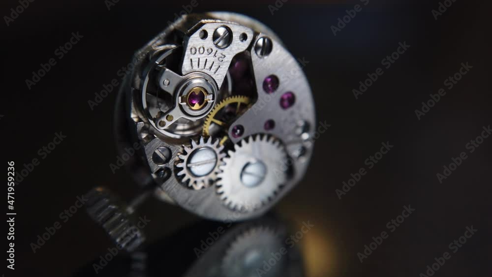 Poster detail shot. the rotation of the pendulum of a wristwatch and the operation of the mechanism inside 