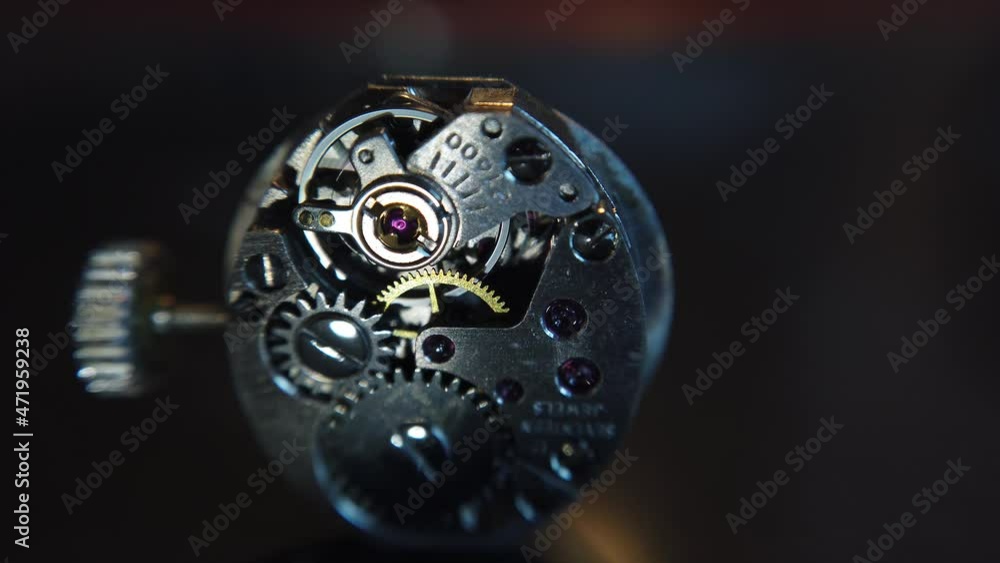 Poster detail shot. the rotation of the pendulum of a wristwatch and the operation of the mechanism inside 