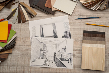 house sketch layout with color swatches palette at office desk