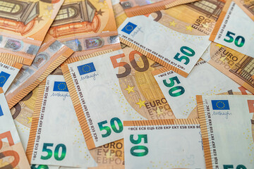 new clean beautiful banknotes of 50 euros were laid out on a spacious new table.
