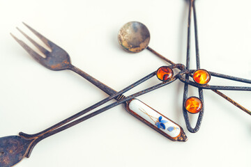 Old-fashioned, vintage cutlery on the white background.