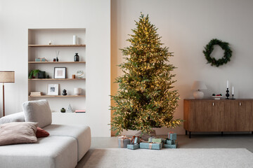 Stylish christmas living room interior with sofa, lamp, christmas tree and wreath, stars, gifts and decoration. Family time. Template.