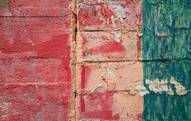 Detail of painted bricks on the outside of an old building