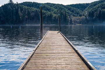Early morning steam from Tenmile Lake rises around the dock at Lakeview, Oregon, USA
