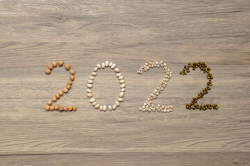 2022 New Year and New You with organic Beans; white, green, chickpeas and Adlay on table. Goals, Healthy, Motivation, Resolution, Weight loss, dieting and world food day concept