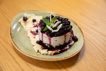 Blueberry vanilla raw cake served on plate