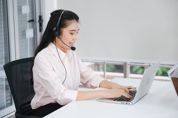 beautiful asia woman working call center operator with headset in office or workplace