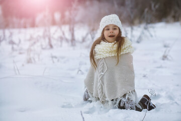 Happy family playing and laughing in winter outdoors in the snow. City park winter day.