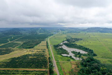 Scenic aerial view flying over the land field.