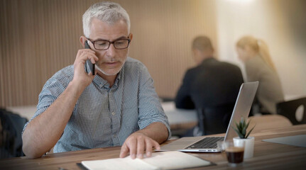 man working coworking on his laptop in an office