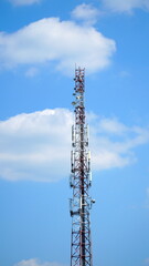 Obraz premium Technology on the top of the telecommunication GSM 5G, 4G, 3G tower.Cellular phone antennas on a building roof.silhouette of Telecommunication mast television antennas.