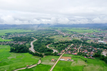 Scenic aerial view flying over the land field.