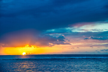 Fototapeta na wymiar Amazing sunset above the ocean. Yellow, blue and orange colors.