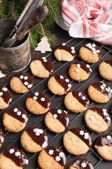 Christmas cookies with chocolate on a lattice. Christmas food preparation process. christmas pattern