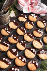 Obraz na płótnie Canvas Christmas cookies with chocolate on a lattice. Christmas food preparation process. christmas pattern