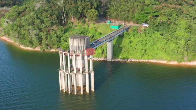 Outlet Tower Of Presa de Hatillo On A Sunny Summer Day In Dominican Republic. - aerial orbit