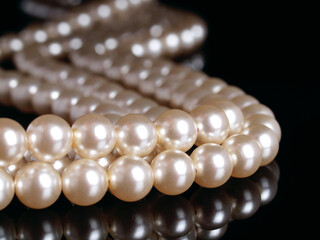 Pearl necklace on a black background