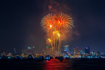 fantastic and colorful fireworks display over the night sky of the city during a festival