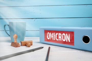Documents and information on the office desk. Coronavirus Covid-19 Omicron mutation variant