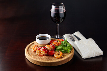 canapes with shrimp and tomato, sprinkled with sesame seeds with arugula, sauce and wine,Skewers 