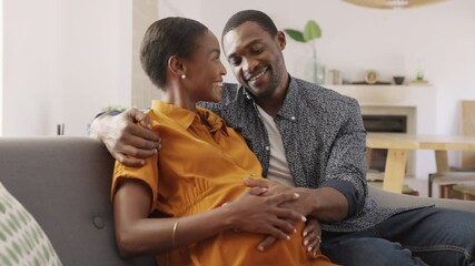 Happy loving pregnant black couple expecting baby