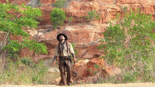 Cowboys from 1800s America at the Grand Canyon hot from lack of water until faint