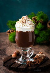 Hot milk chocolate with whipped cream. Winter and autumn warming drink. Copy space