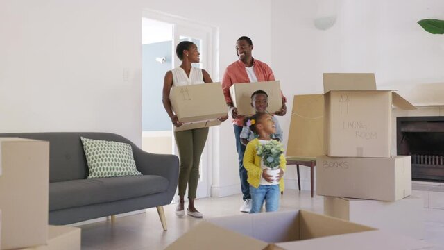 Black family with two children moving house