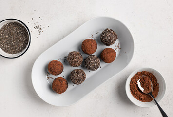 vegan energy balls made from dates, nuts, chia seeds and cacao. vegan alternative food. top view