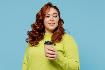 Young minded chubby overweight plus size big fat fit woman wearing green sweater hold takeaway...