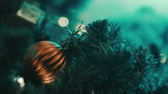 Christmas ball decorate on pine tree with blurred bokeh road light sparkling fairy background. Merry x mas