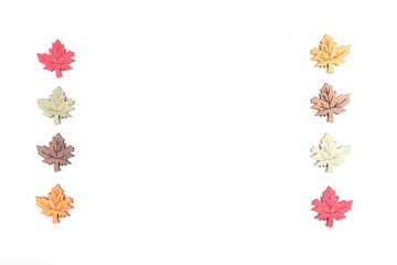 Two lines of wooden decorative leaves of a tree isolated on white
