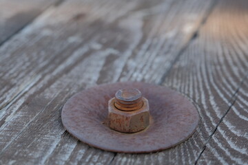 rusty metal bolt. rusty metal bolt and nut on wooden surface