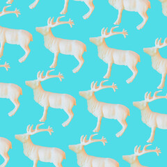 Pattern of white reindeers on blue background. Christmas decorations