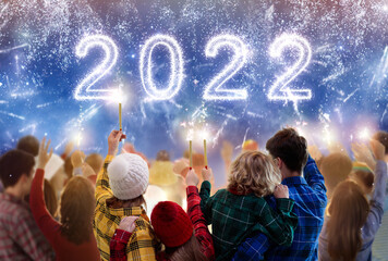 Happy new year. Family watching fireworks.