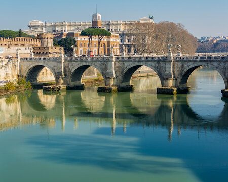 A view of Ponte Sant'Angelo (Bridge of Hadrian) on Tiber river in front of Castel Sant'Angelo (Castle of the Holy Angel)  in Parco Adriano, Rome, Italy