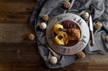 Plate with christmas meal on wooden and rustic table